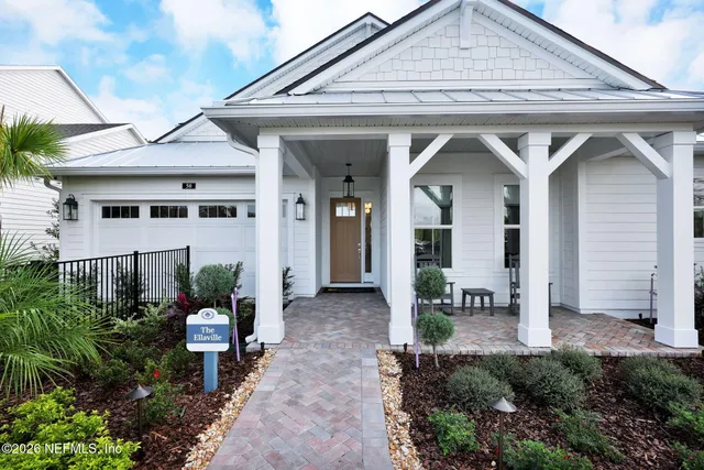a kitchen with a appliances and chandelier