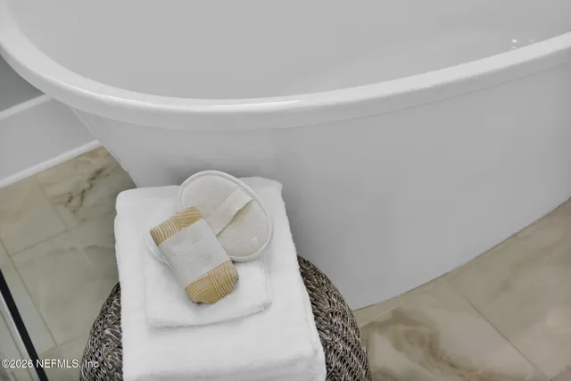 a view of a backyard with a garden and swimming pool