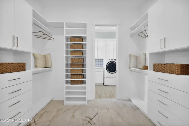 a front view of a house with a yard table and chairs