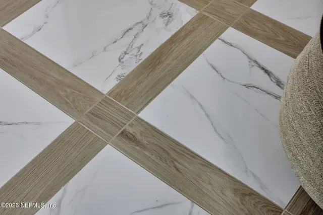 a living room with furniture a wooden floor and a chandelier