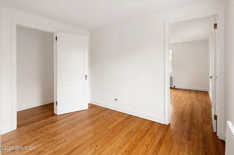 an empty room with wooden floor