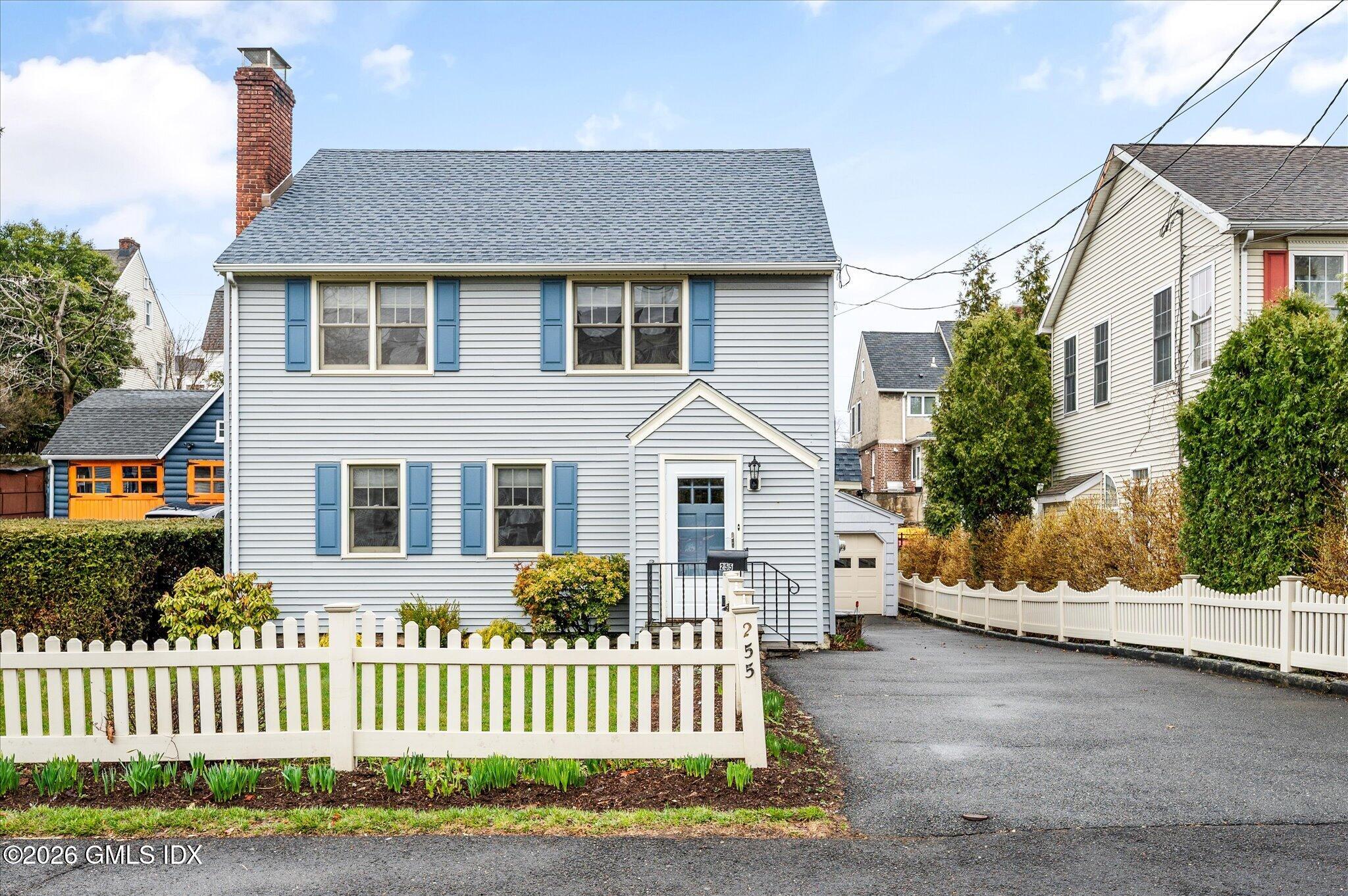 255 Byram Road Greenwich, CT 06830 - Photo 3 of 26 a front view of a house with a garden