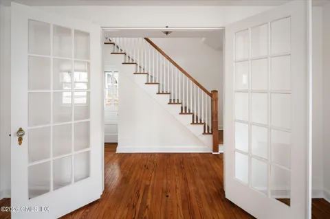 a view of entryway with wooden floor