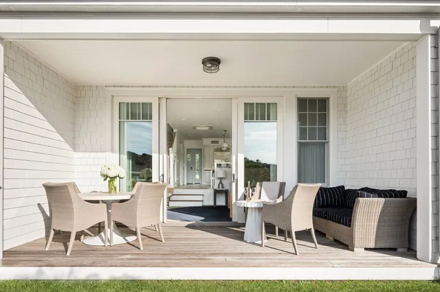a dining room with furniture and wooden floor