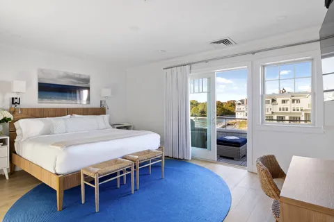 a bedroom with a bed and a couch