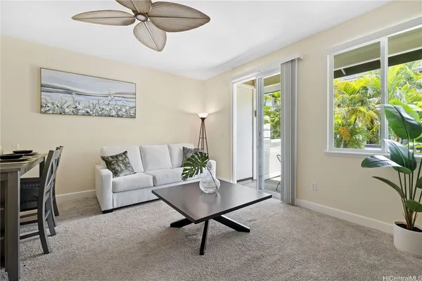 a living room with furniture and a window