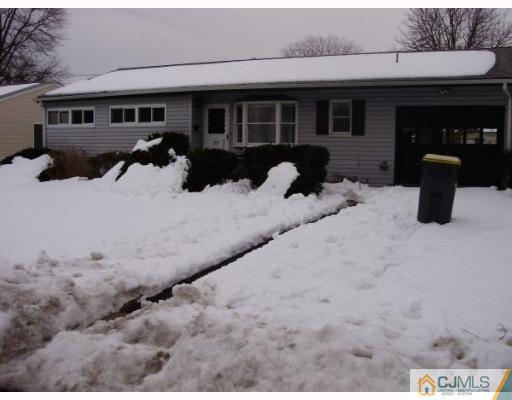 77 Princeton Road Old Bridge, NJ 08859 - Photo 1 of 8 a view of a house with snow in the background