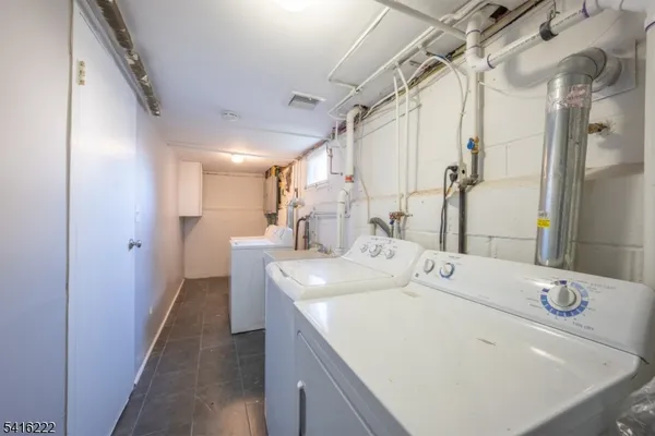 a en suite bathroom with a double vanity sink mirror and shower