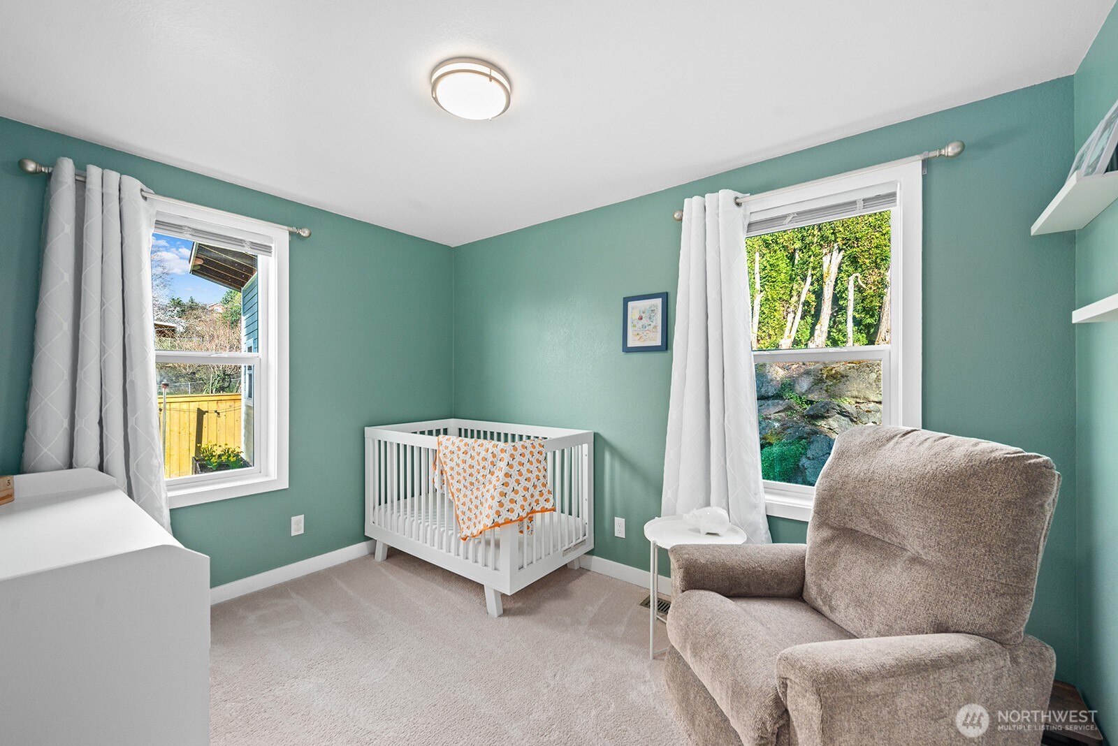 443 Windsor Way Northeast Renton, WA 98056 - Photo 17 of 28 a living room with furniture and a window