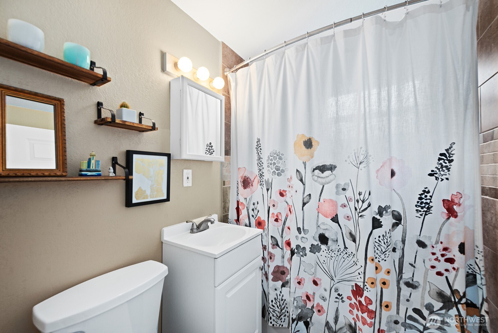 443 Windsor Way Northeast Renton, WA 98056 - Photo 18 of 28 a bathroom with a shower curtain sink and a curtain