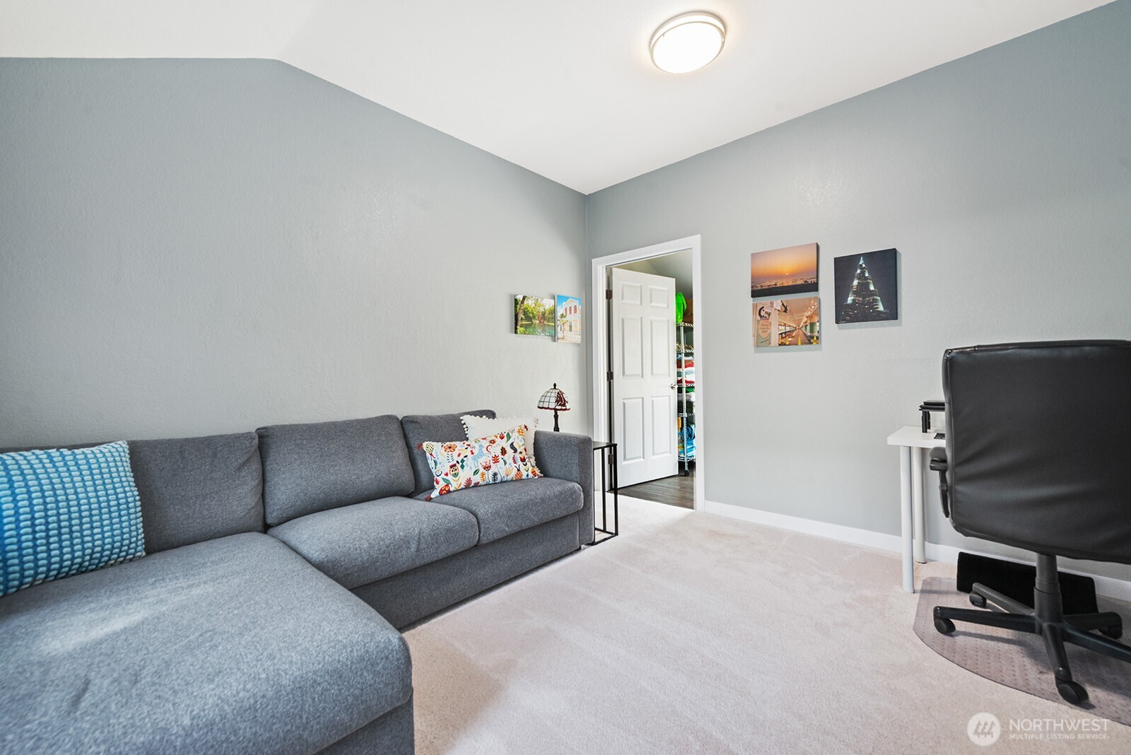 443 Windsor Way Northeast Renton, WA 98056 - Photo 20 of 28 a living room with furniture and a flat screen tv