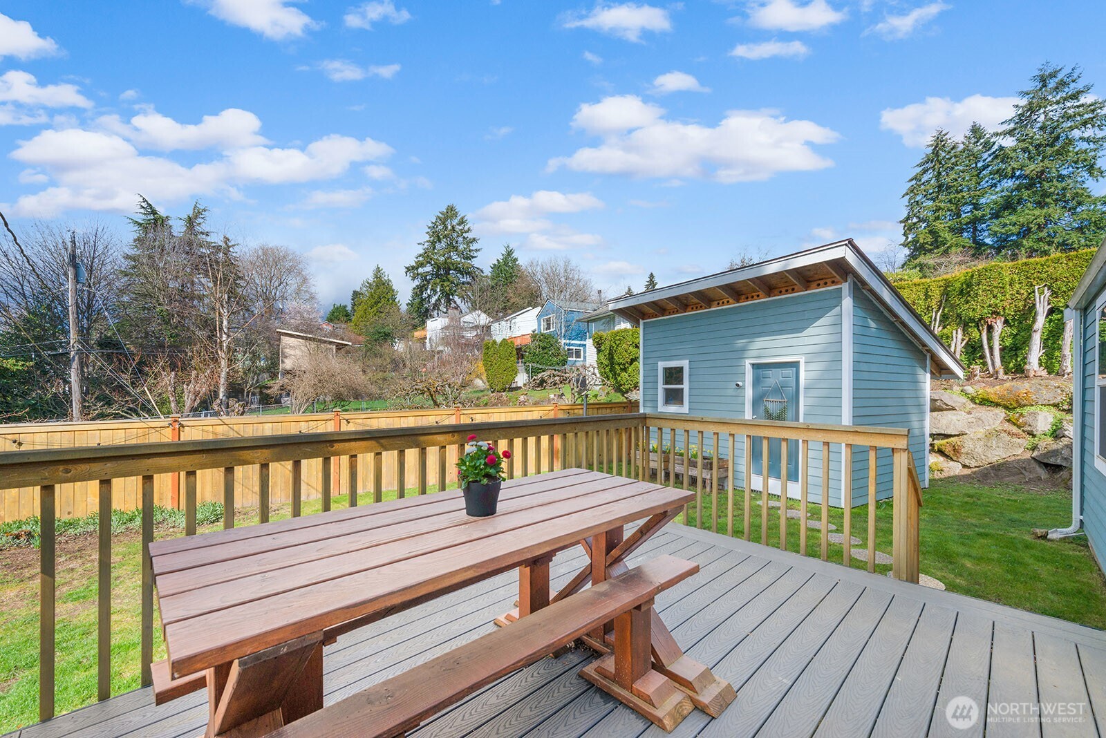 443 Windsor Way Northeast Renton, WA 98056 - Photo 23 of 28 a view of a wooden deck with a bench