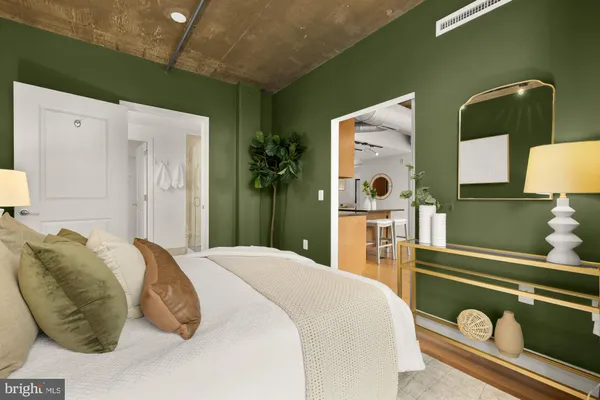 a bedroom with a bed and ceiling fan