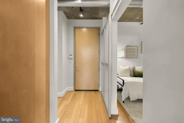 a view of a bedroom from a hallway