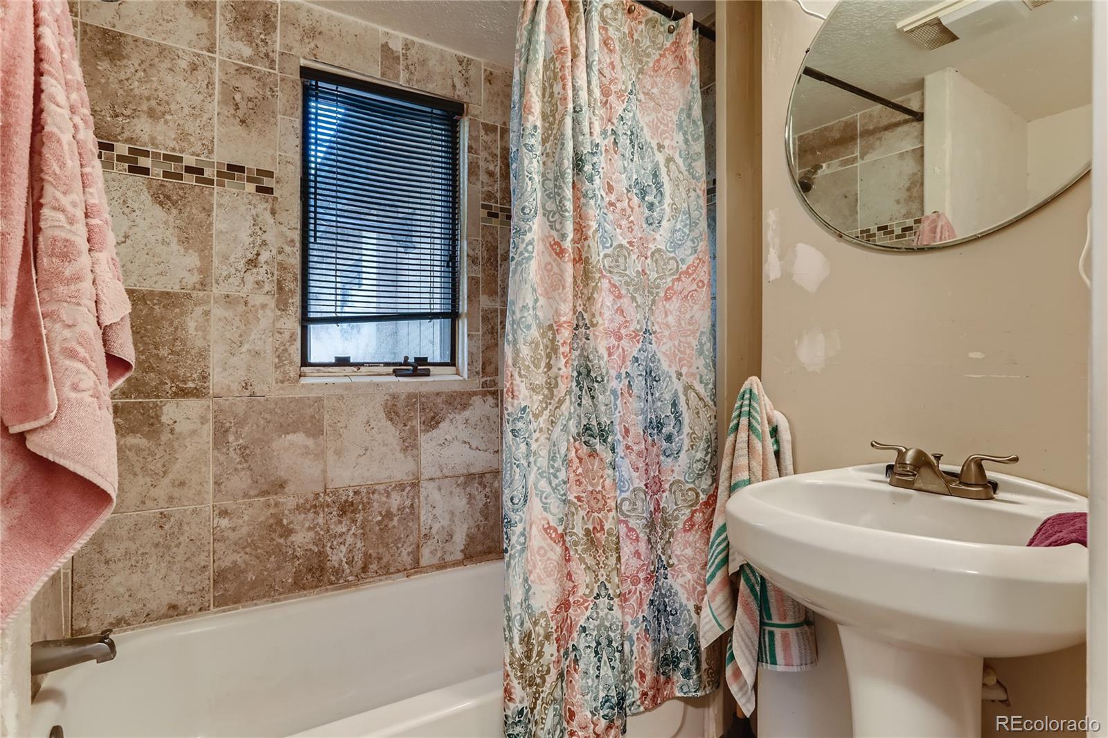 297 Neal Road Bailey, CO 80421 - Photo 7 of 17 a bathroom with a sink and a mirror