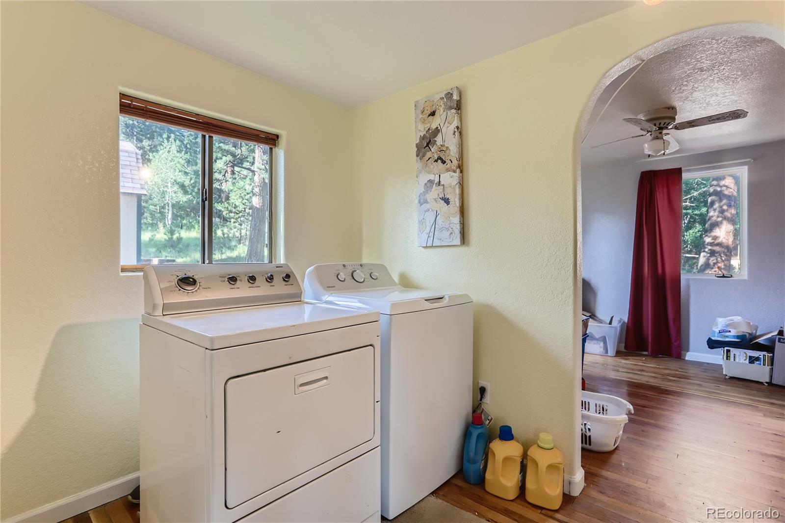 297 Neal Road Bailey, CO 80421 - Photo 8 of 17 a view of a sink and dishwasher with wooden floor
