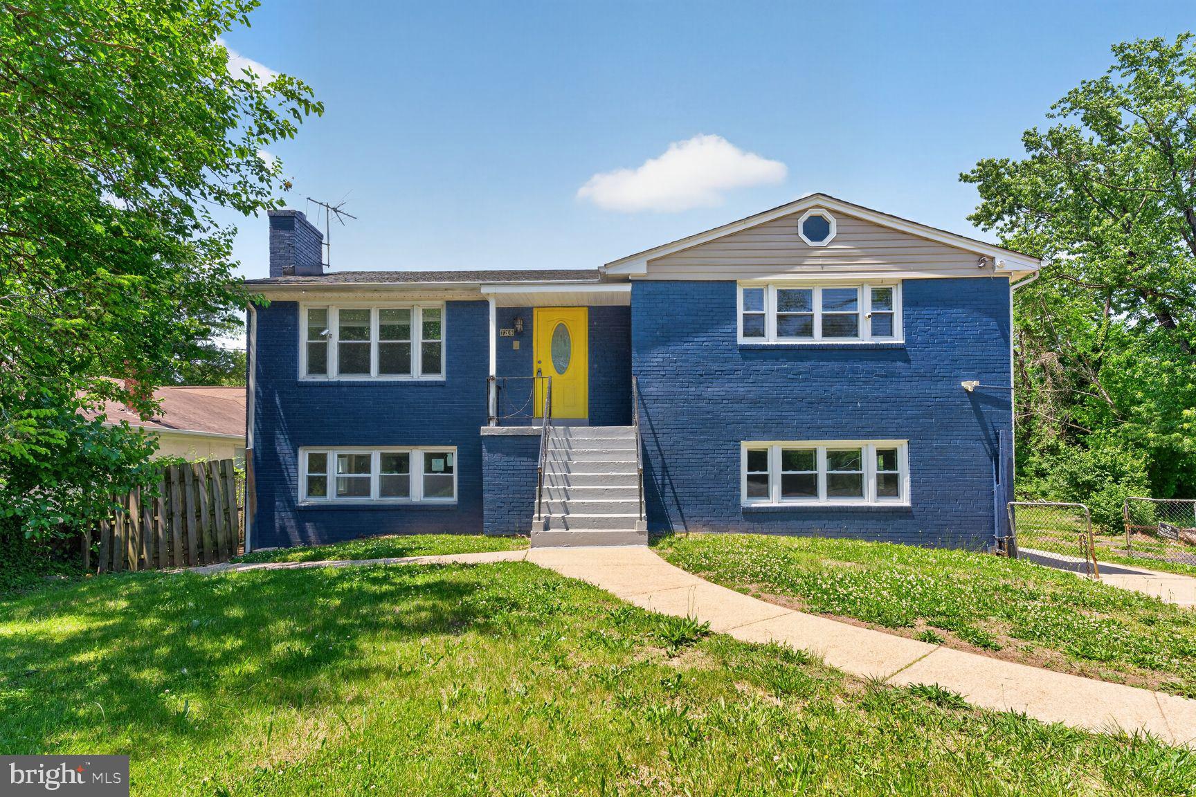 7205 Livingston Road Oxon Hill, MD 20745 - Photo 1 of 25 Charming blue home with vibrant door.