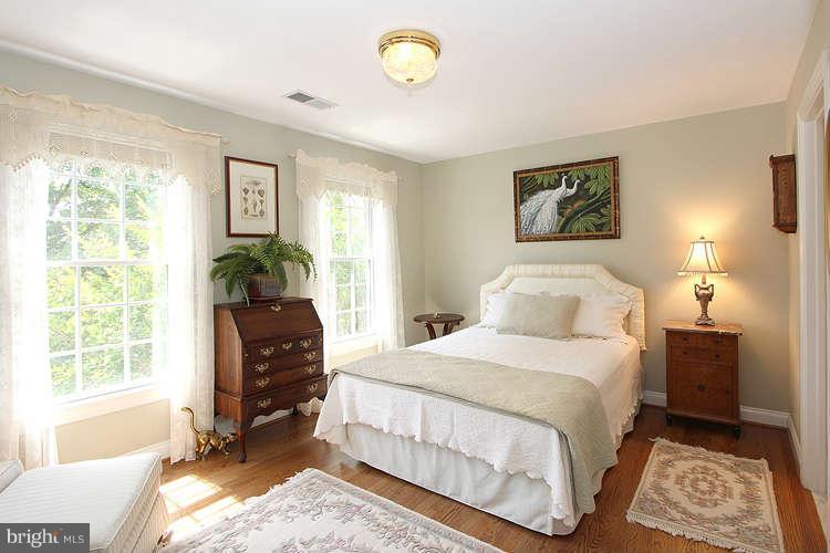2038 Lord Fairfax Road Vienna, VA 22182 - Photo 12 of 24 a bedroom with a bed and a window