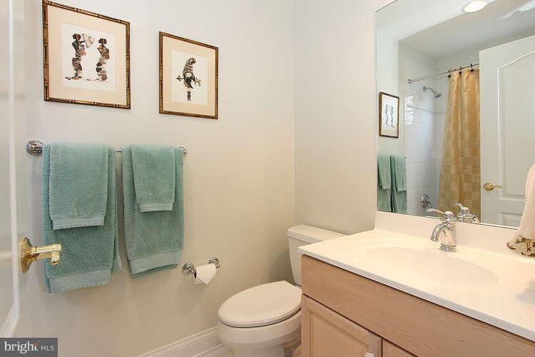 2038 Lord Fairfax Road Vienna, VA 22182 - Photo 13 of 24 a bathroom with a sink a toilet and shower