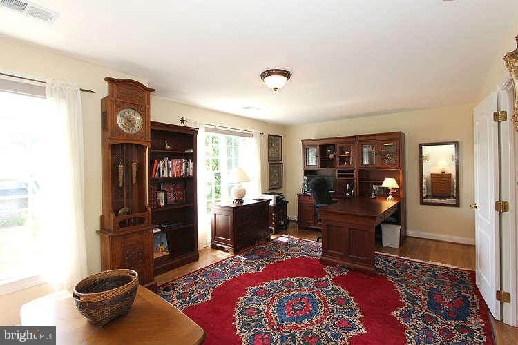 2038 Lord Fairfax Road Vienna, VA 22182 - Photo 14 of 24 a living room with furniture and a rug