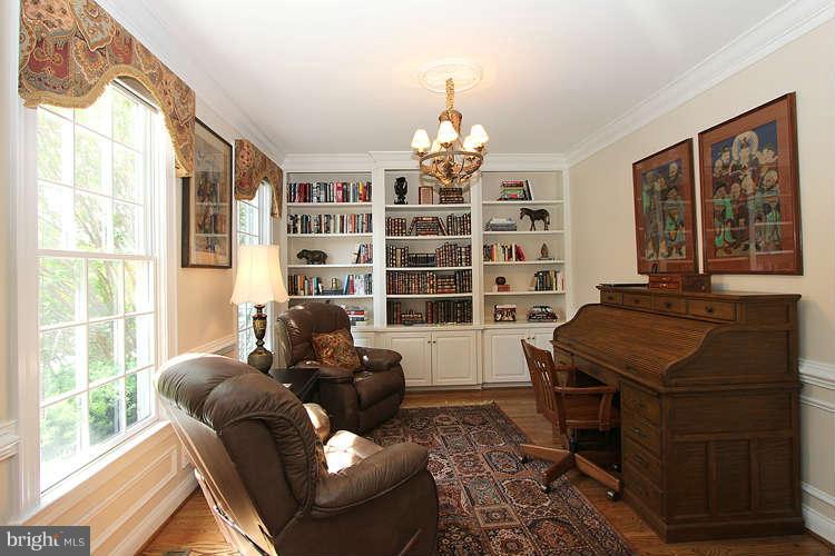 2038 Lord Fairfax Road Vienna, VA 22182 - Photo 3 of 24 a living room with furniture and a window