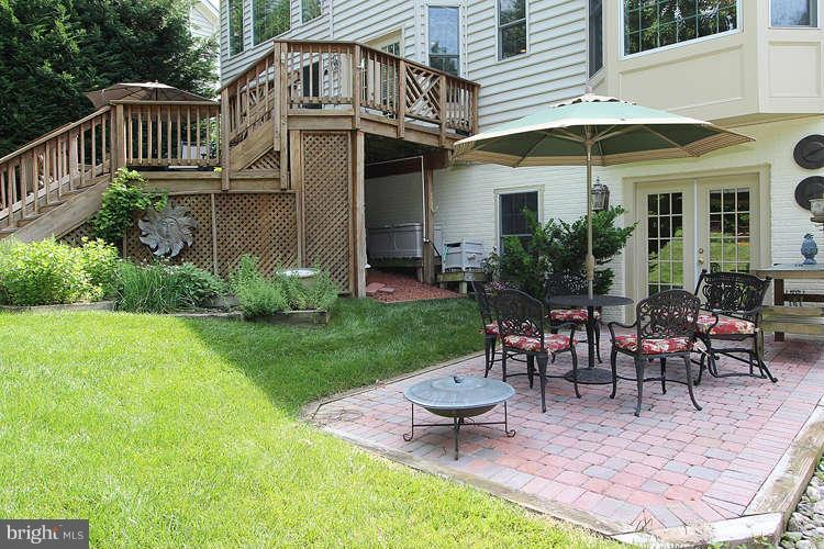 2038 Lord Fairfax Road Vienna, VA 22182 - Photo 22 of 24 a view of a house with backyard and sitting area