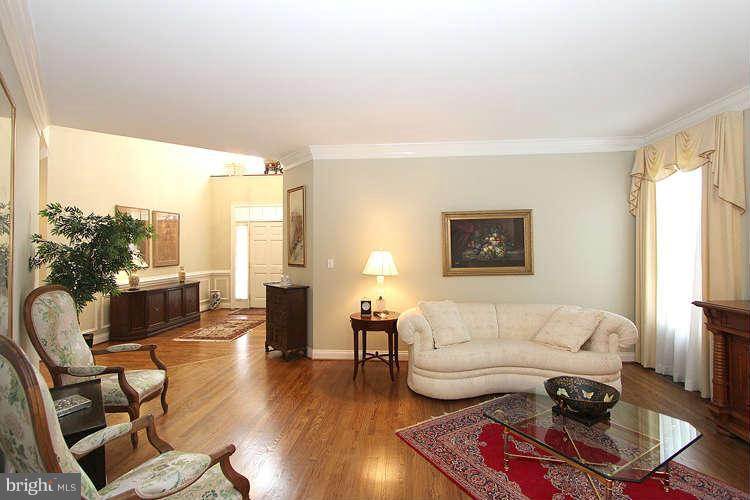 2038 Lord Fairfax Road Vienna, VA 22182 - Photo 4 of 24 a living room with furniture and a large window