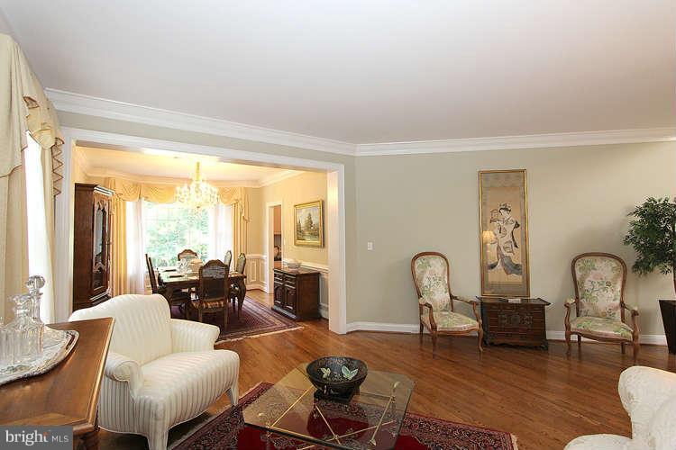 2038 Lord Fairfax Road Vienna, VA 22182 - Photo 5 of 24 a living room with furniture rug and a large window