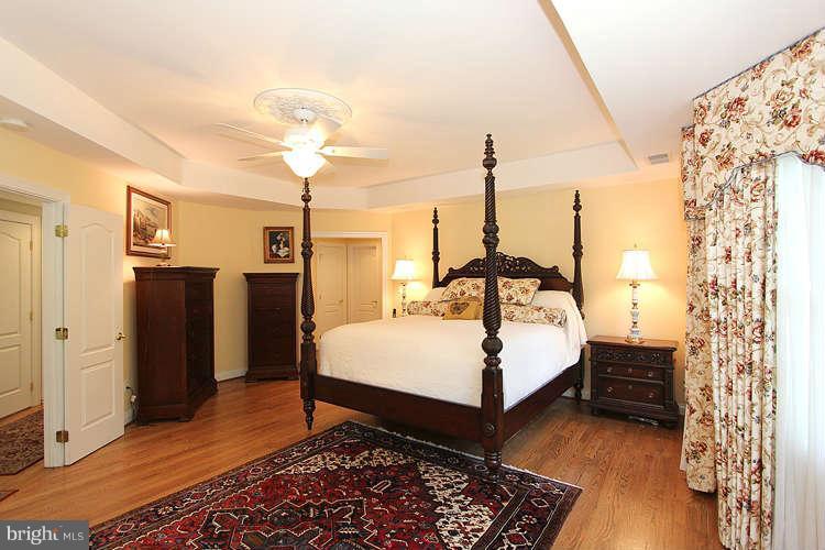 2038 Lord Fairfax Road Vienna, VA 22182 - Photo 9 of 24 a room with a bed and a chandelier