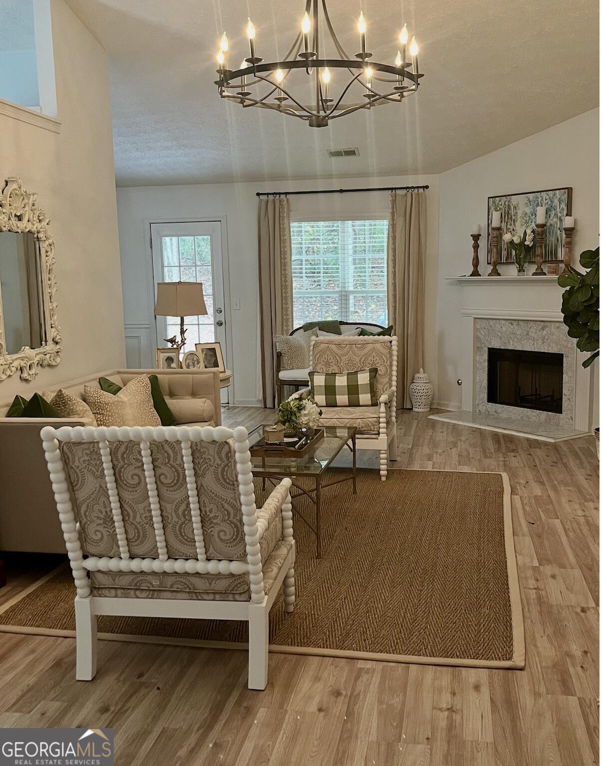 11 Winter Lane Newnan, GA 30265 - Photo 4 of 11 a living room with furniture a fireplace and a flat screen tv