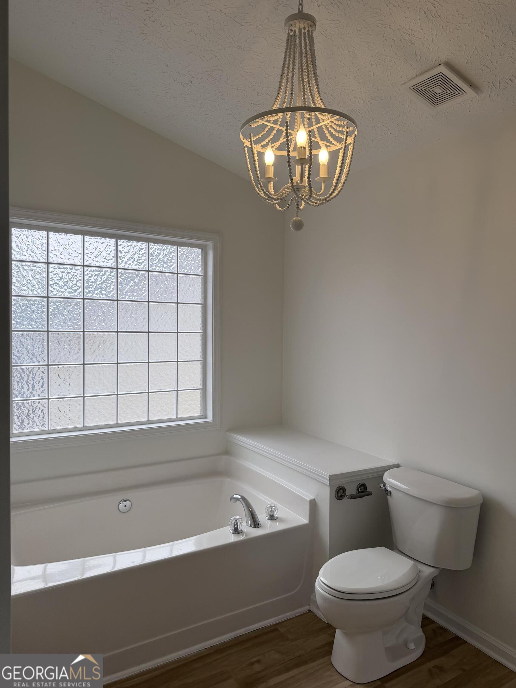 11 Winter Lane Newnan, GA 30265 - Photo 7 of 11 a bathroom with a toilet a sink and bathtub