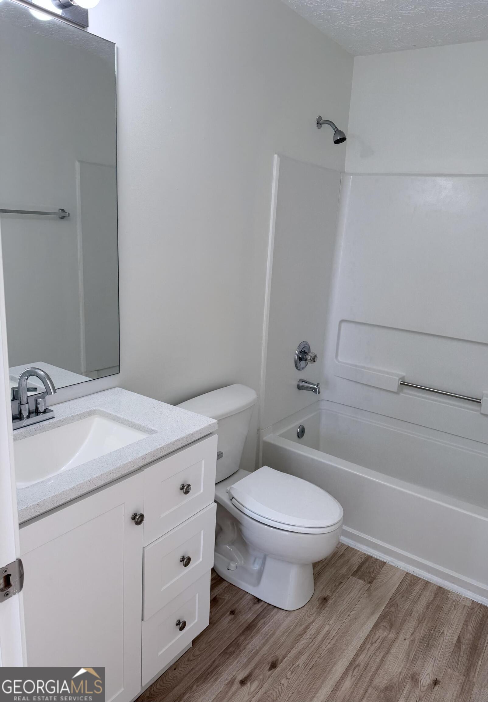 11 Winter Lane Newnan, GA 30265 - Photo 9 of 11 a bathroom with a sink a toilet and shower