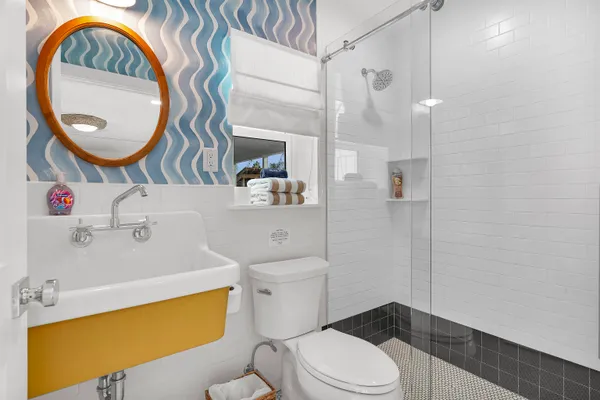 a view of an entryway with wooden floor