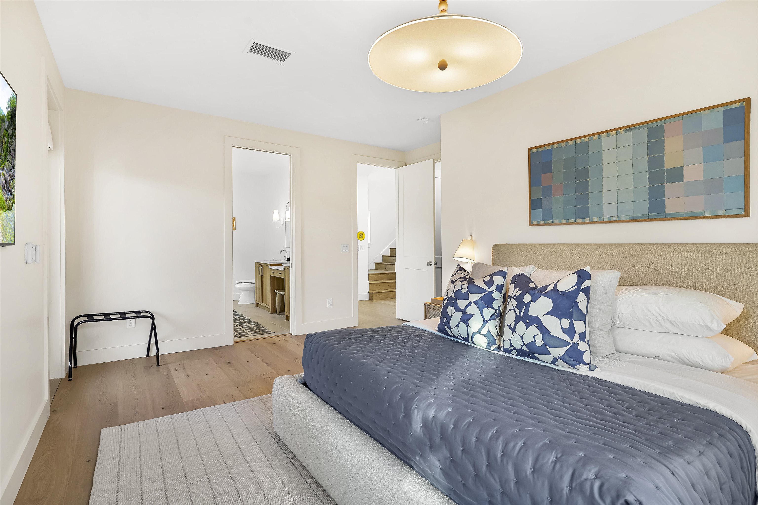 6435 Broward Street St. Augustine, FL 32080 - Photo 17 of 56 a spacious bedroom with a bed and wooden floor