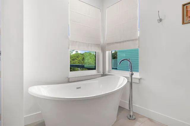 a bedroom with a bed and a book shelf