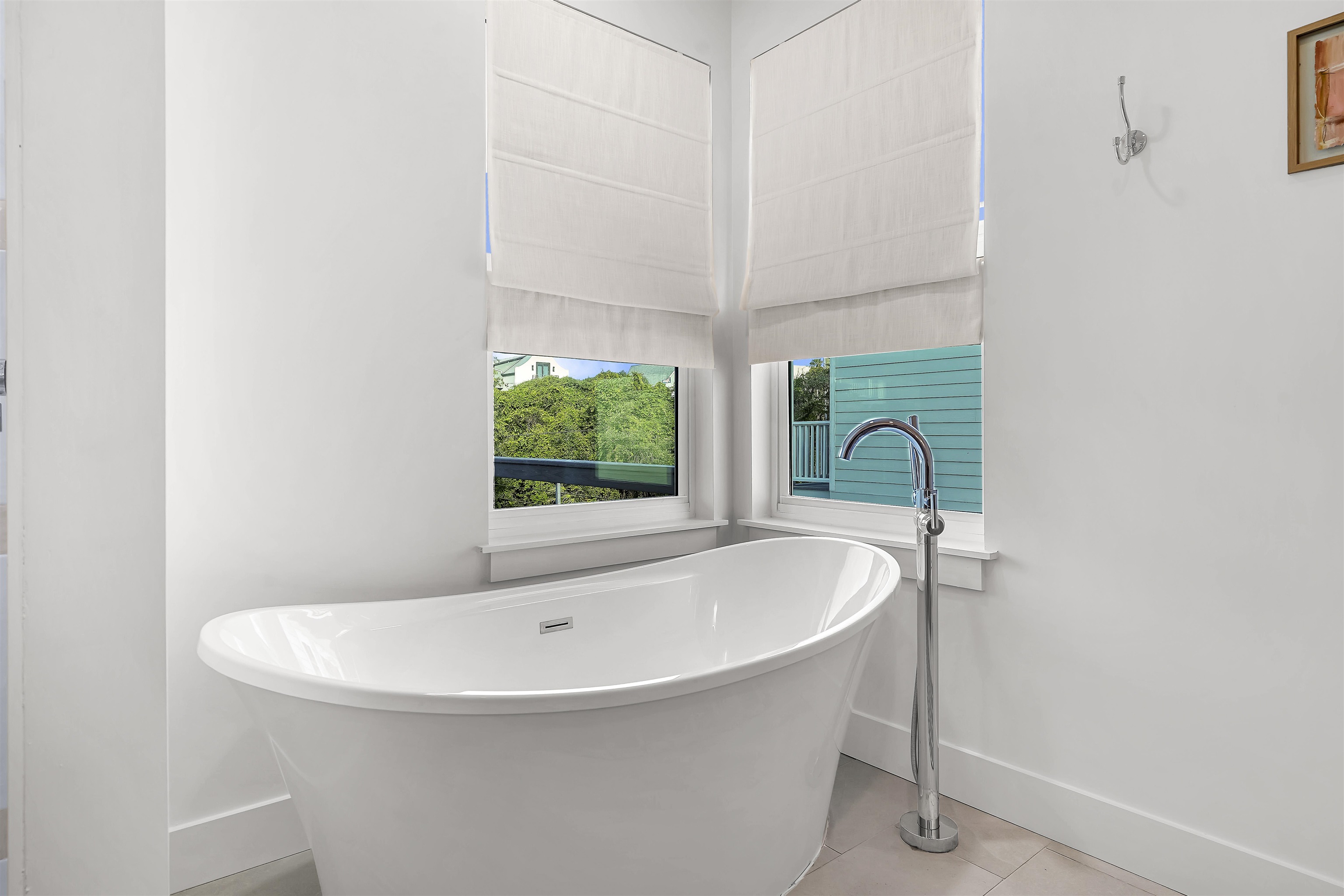 6435 Broward Street St. Augustine, FL 32080 - Photo 21 of 56 a white bath tub sitting in a bathroom