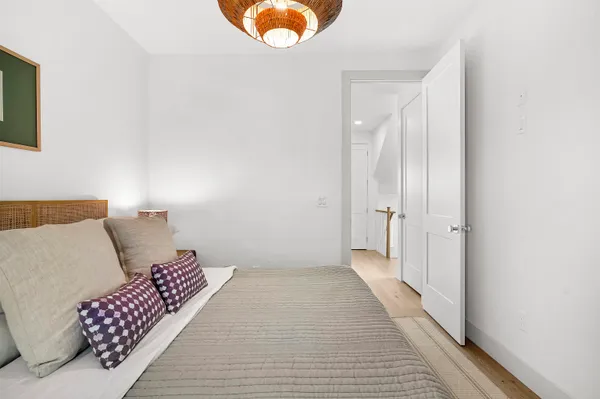 a room with a bed and a window