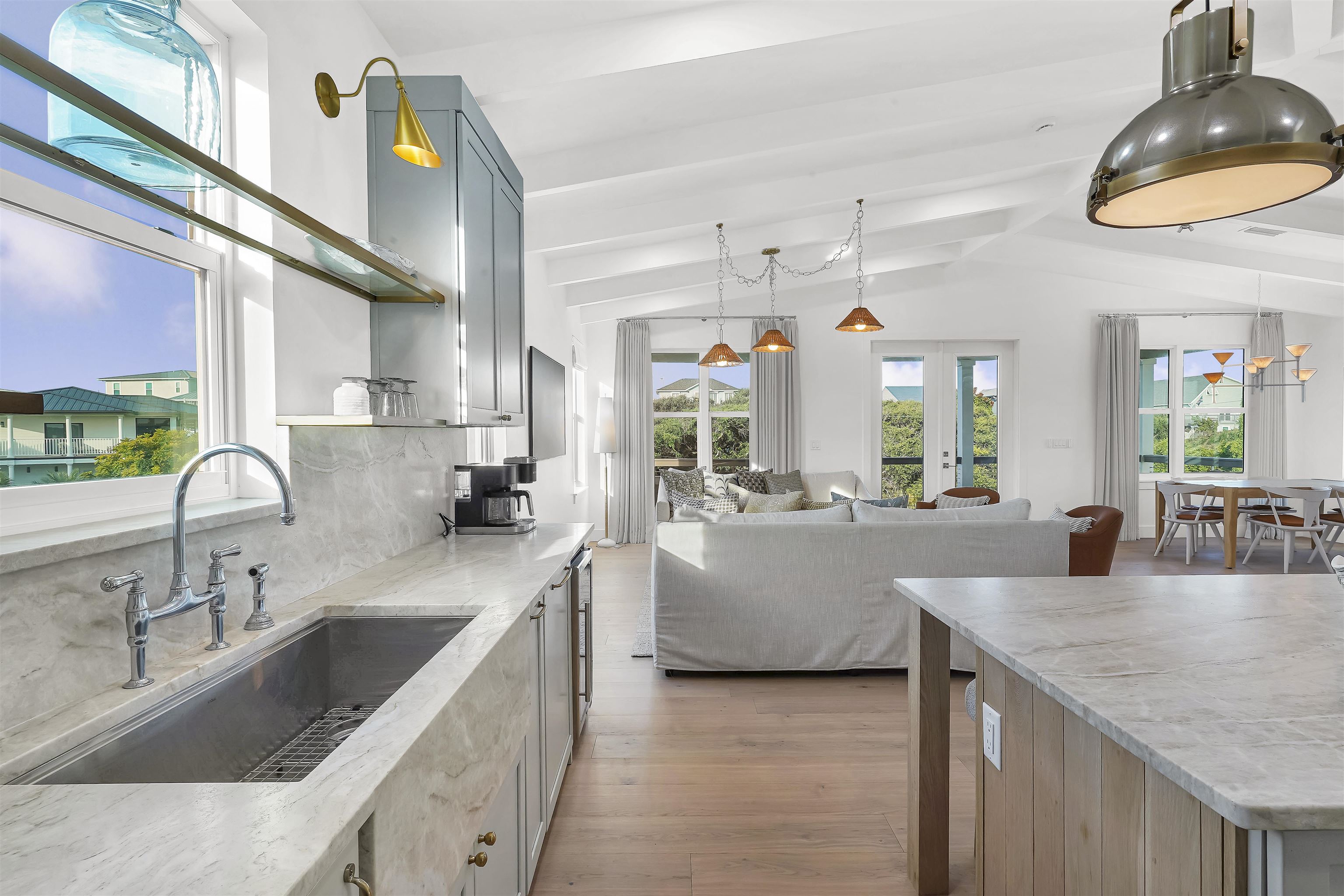 6435 Broward Street St. Augustine, FL 32080 - Photo 33 of 56 a large kitchen with stainless steel appliances granite countertop a sink a stove and a wooden floors