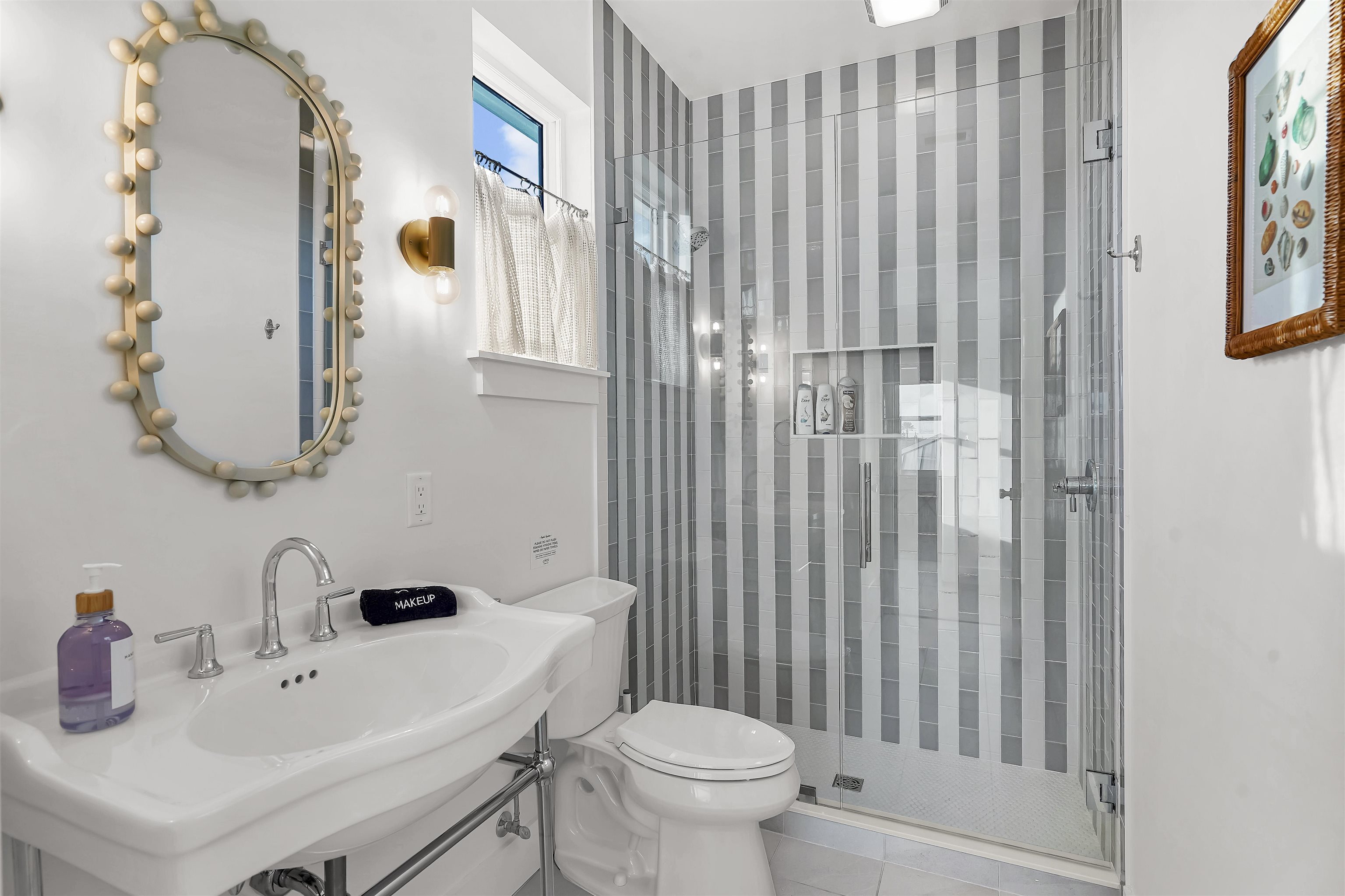 6435 Broward Street St. Augustine, FL 32080 - Photo 37 of 56 a bathroom with a sink and a mirror