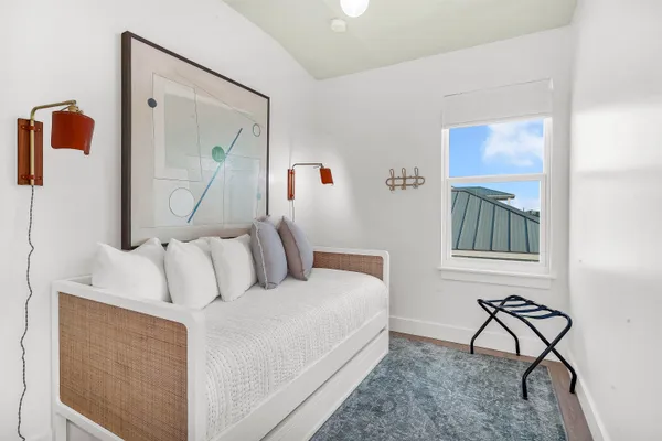 a balcony with wooden floor and furniture