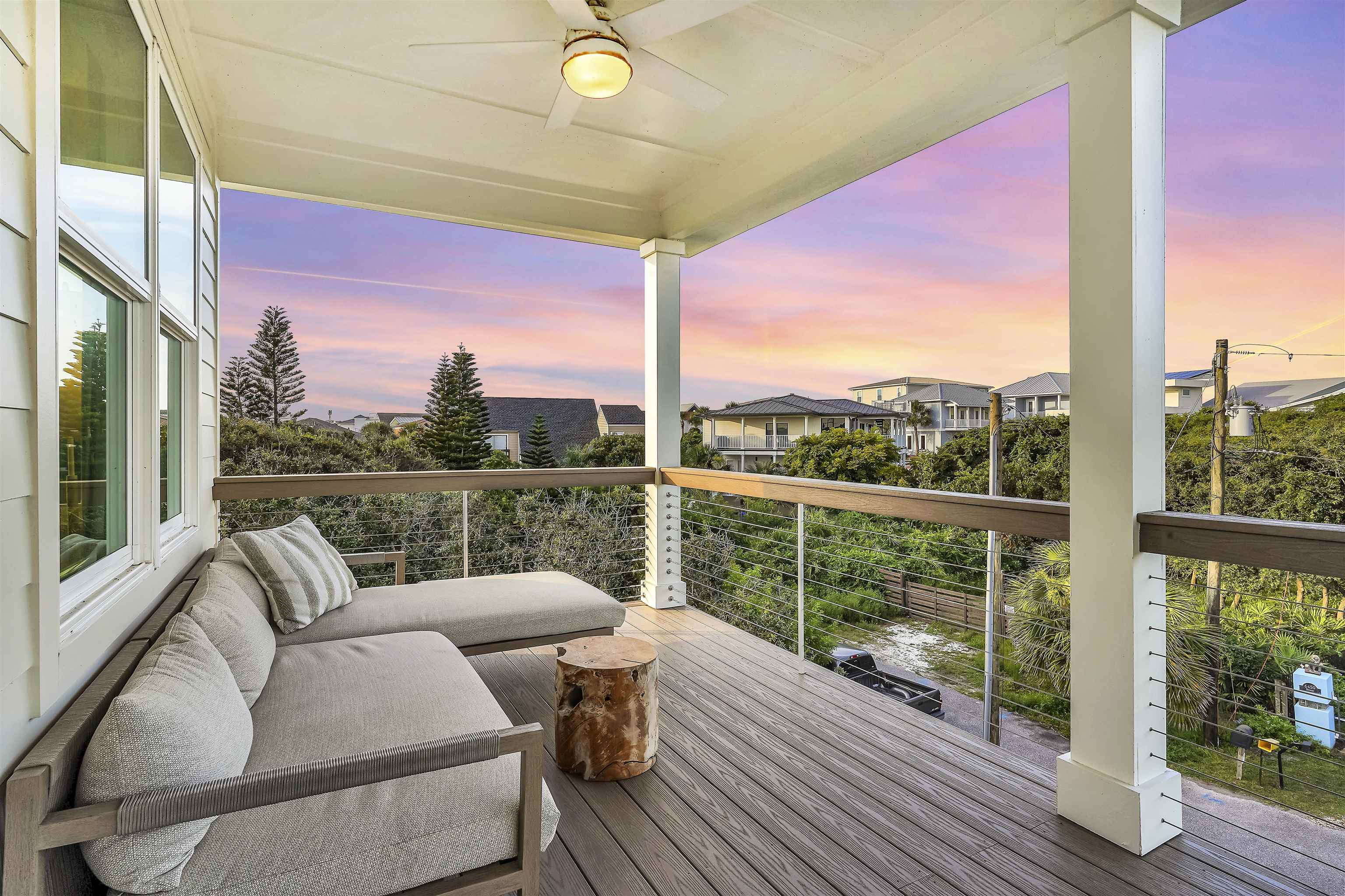 6435 Broward Street St. Augustine, FL 32080 - Photo 40 of 56 a balcony with wooden floor table and chairs