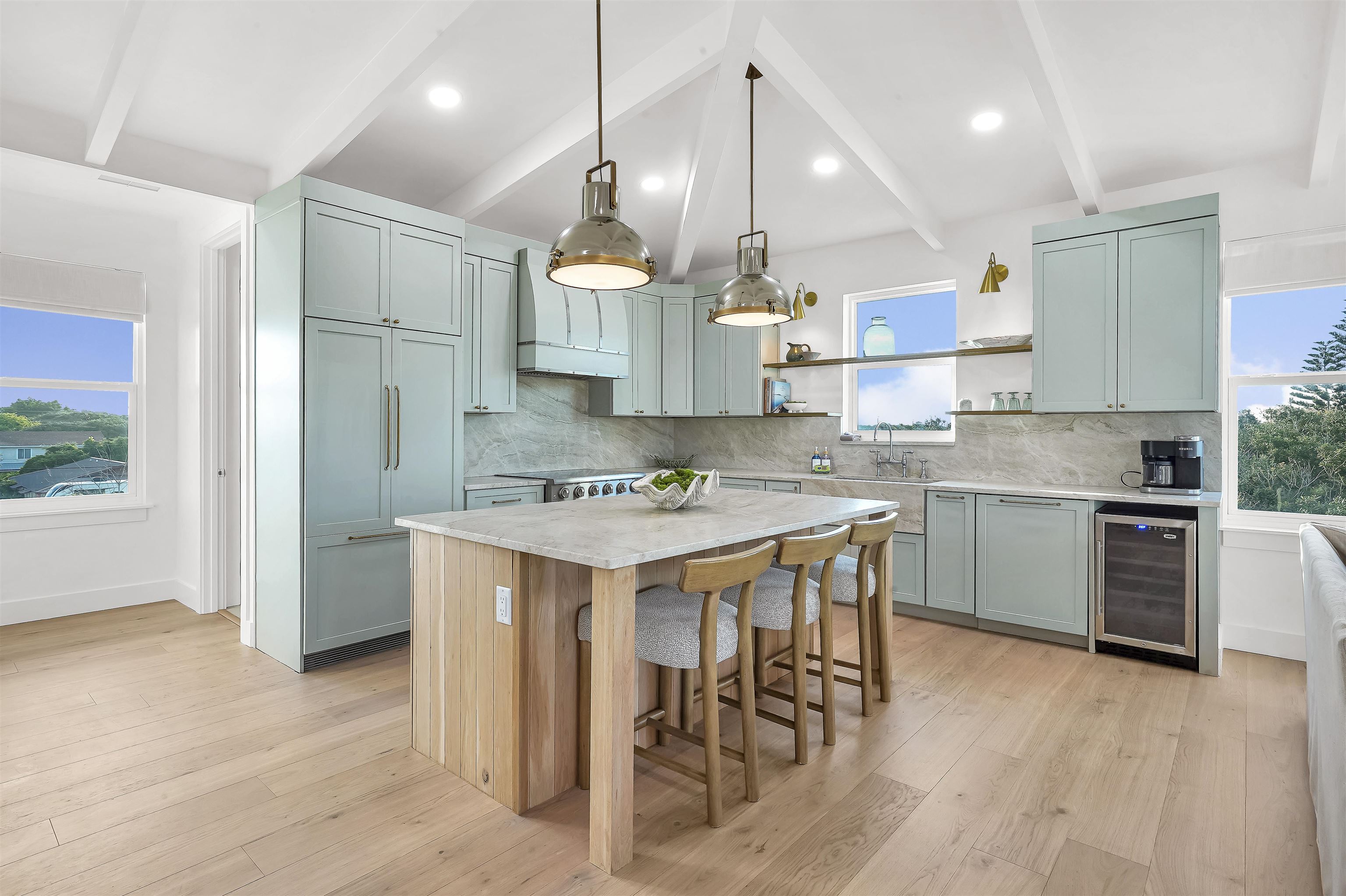 6435 Broward Street St. Augustine, FL 32080 - Photo 4 of 56 a kitchen with kitchen island granite countertop a sink a stove a refrigerator and island with wooden floor
