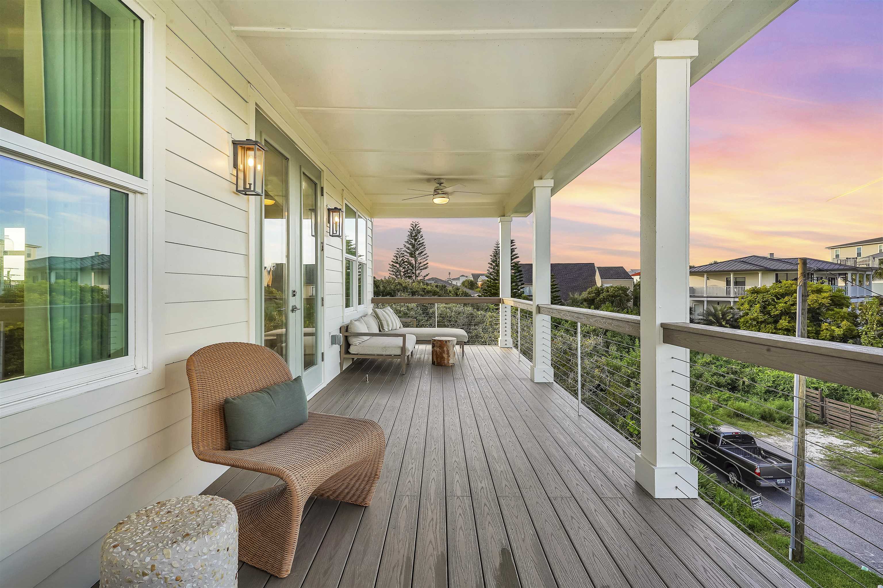 6435 Broward Street St. Augustine, FL 32080 - Photo 42 of 56 a balcony with wooden floor and furniture