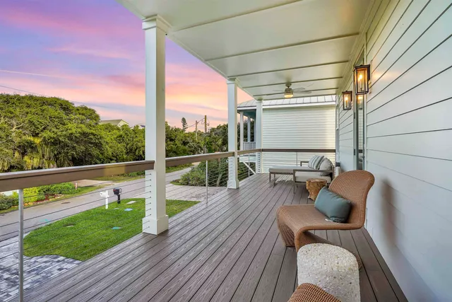 a front view of house with yard and outdoor seating