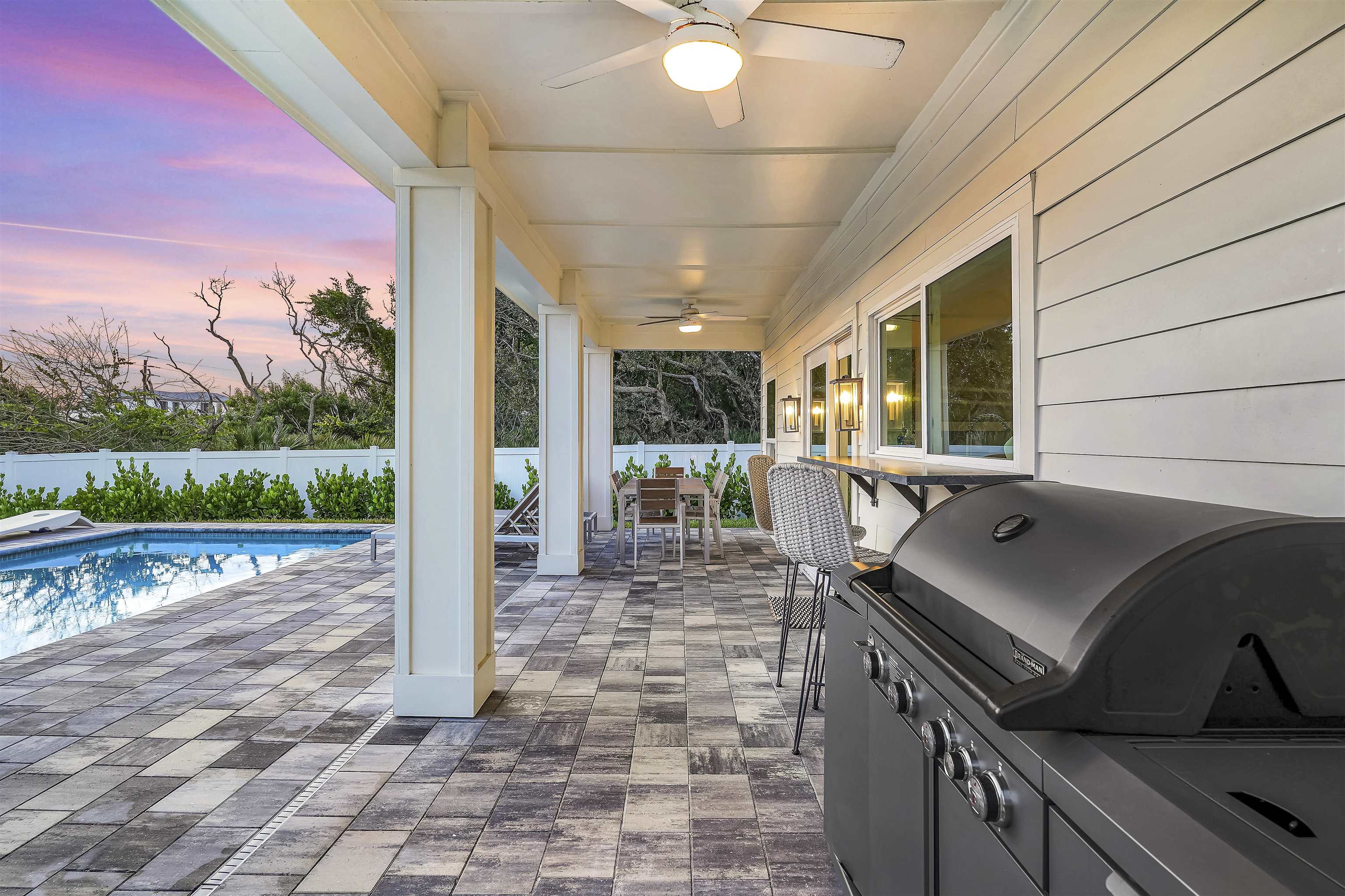 6435 Broward Street St. Augustine, FL 32080 - Photo 44 of 56 a view of a patio with a table and chairs