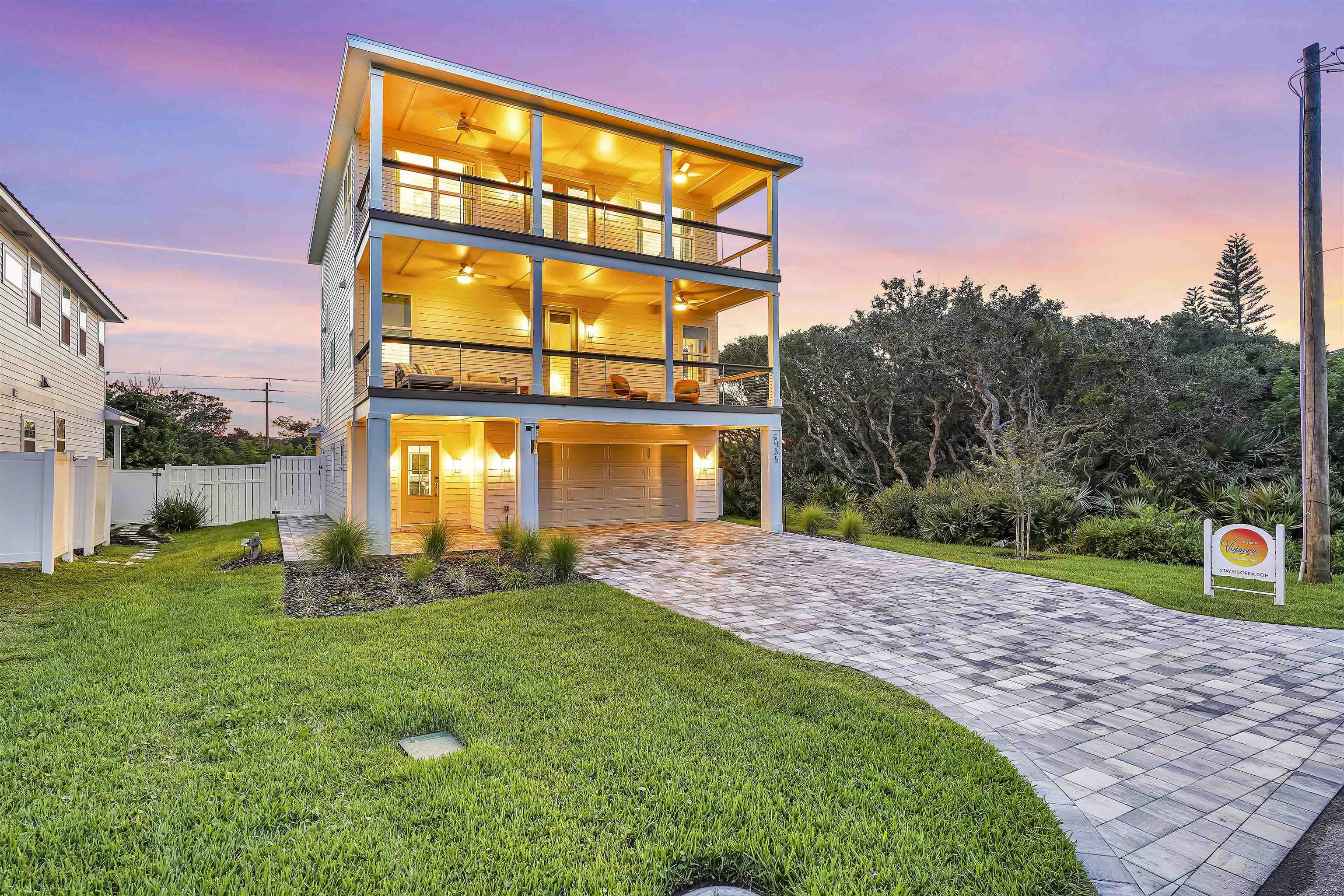 6435 Broward Street St. Augustine, FL 32080 - Photo 7 of 56 a front view of a house with a yard