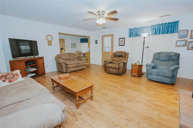 a bedroom with furniture and a flat screen tv
