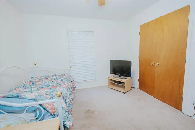 a room with a bed and flat screen tv