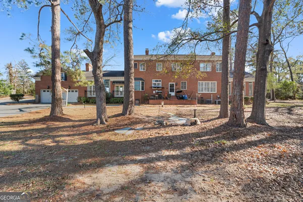 a view of a yard with a tree