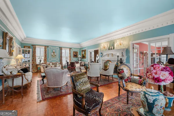 a very nice looking living room with furniture and a large window